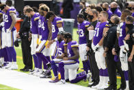 Minnesota Vikings running back Alexander Mattison (25) and Ameer Abdullah kneel during the National Anthem before the start of an NFL football game against the Tennessee Titans, Sunday, Sept. 27, 2020, in Minneapolis. The Titans defeated the Vikings 31-30. The NFL says the Tennessee Titans and Minnesota Vikings are suspending in-person activities after the Titans had three players test positive for the coronavirus, along with five other personnel. The league says both clubs are working closely with the NFL and the players’ union on tracing contacts, more testing and monitoring developments. The Titans are scheduled to host the Pittsburgh Steelers on Sunday. (AP Photo/David Berding)