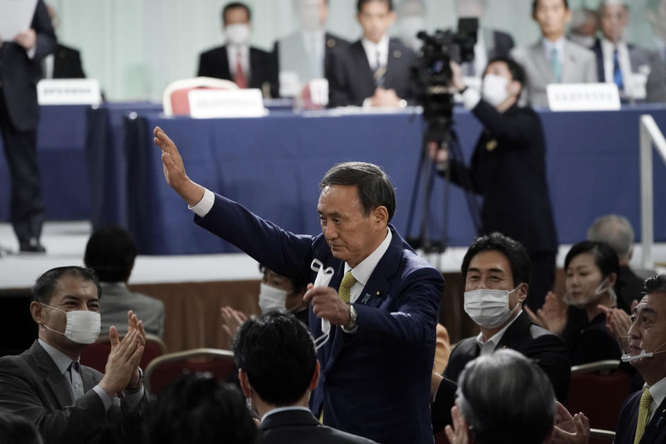 Japanese Chief Cabinet Secretary Yoshihide Suga acknowledges as he is elected as new head of Japan's ruling party at the Liberal Democratic Party's (LDP) leadership election Monday, Sept. 14, 2020, in Tokyo. The ruling LDP chooses its new leader in an internal vote to pick a successor to Prime Minister Shinzo Abe, who announced his intention to resign last month due to illness. (AP Photo/Eugene Hoshiko, Pool)