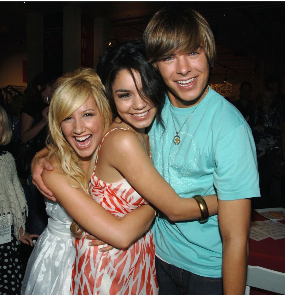 Ashley Tisdale, Vanessa Hudgens, and Zac Efron hug and smile for the camera
