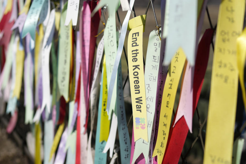 The ribbons with messages wishing for peace between the two Koreas are hanged on the wire fences at the Imjingak Pavilion in Paju, South Korea, Sunday, Feb. 19, 2023. North Korea said Sunday its latest intercontinental ballistic missile test was meant to further bolster its “fatal” nuclear attack capacity against its rivals, as it threatened additional powerful steps in response to the planned military training between the United States and South Korea. (AP Photo/Lee Jin-man)