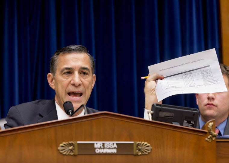 House Oversight Committee Chairman Rep. Darrell Issa, R-Calif., holds up a checklist Wednesday related to the preparation for the implementation of the Obamacare healthcare program, and specifically, the HealthCare.gov website, on Capitol Hill in Washington.