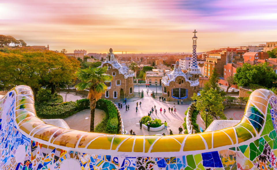 View of the city from Park Guell in Barcelona, Spain with moving clouds. Photo: Getty