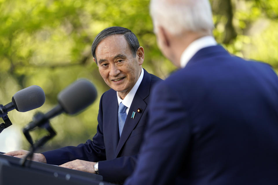 Japanese Prime Minister Yoshihide Suga, and President Joe Biden speak at a news conference in the Rose Garden of the White House, Friday, April 16, 2021, in Washington. (AP Photo/Andrew Harnik)