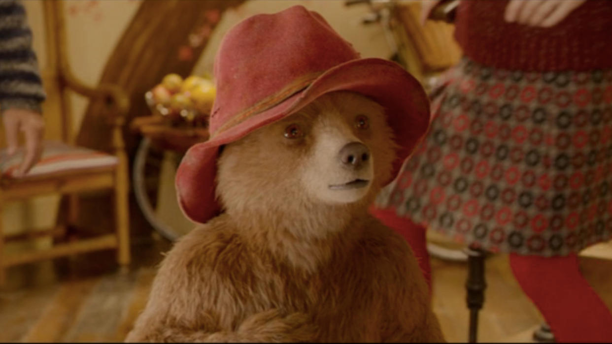  Paddington looks surprised as he stands in the Brown's house in Paddington 2. 