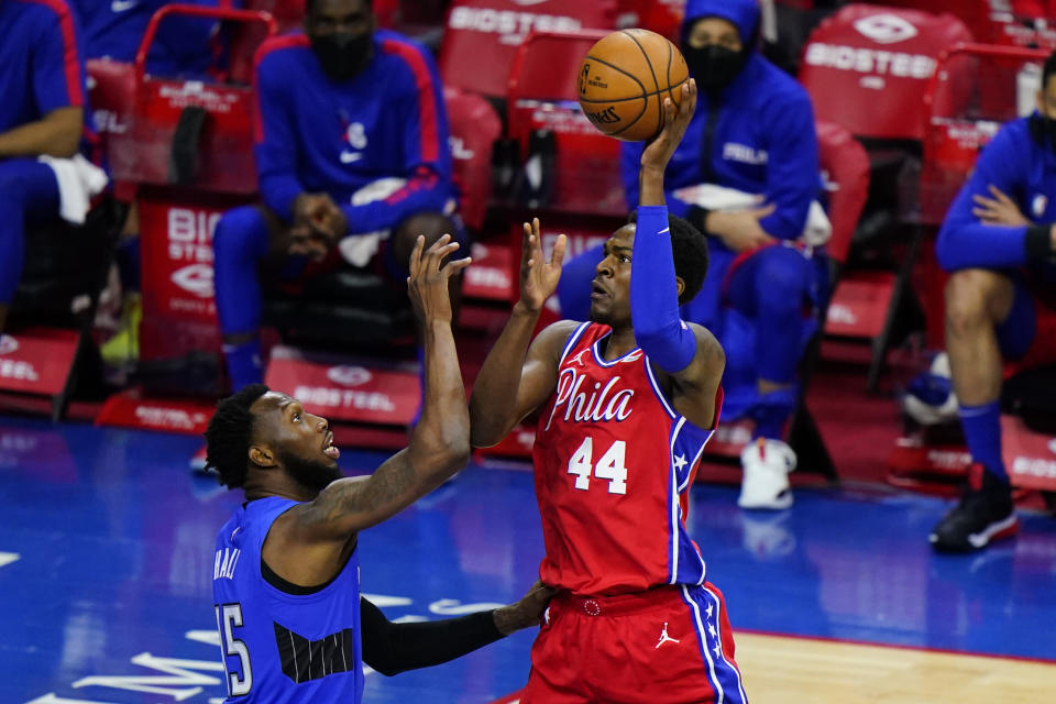 Philadelphia 76ers' Paul Reed, right, goes up for a shot against Orlando Magic's Donta Hall during the second half of an NBA basketball game, Friday, May 14, 2021, in Philadelphia. (AP Photo/Matt Slocum)