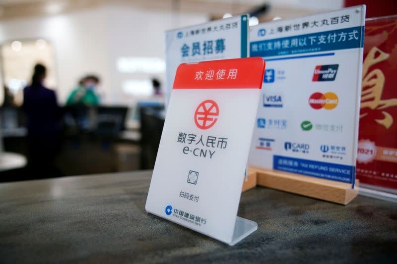 A sign indicating digital yuan, also referred to as e-CNY, is pictured at a shopping mall in Shanghai, China