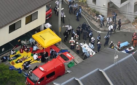 A suspect sprayed an unidentified liquid to accelerate the blaze, Kyoto prefectural police and fire department officials said - Credit: Kyodo News via AP