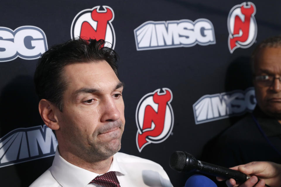 New Jersey Devils interim coach Alain Nasreddine speaks to the media before an NHL hockey game against the Vegas Golden Knights, Tuesday, Dec. 3, 2019, in Newark, N.J. Nasreddine was named interim head coach by Devils General Manager Ray Shero after the Devils fired head coach John Hynes earlier in the day. (AP Photo/Kathy Willens)