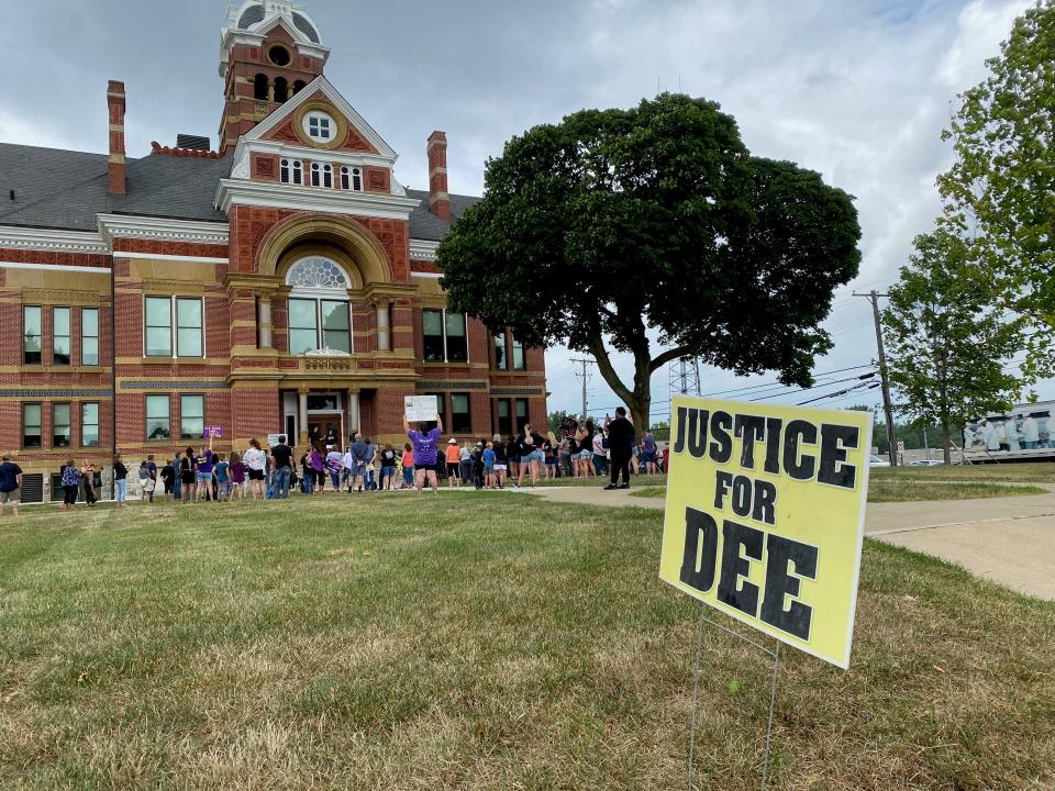 People attend a rally Monday at the old Lenawee County Courthouse in Adrian for missing Dee Warner.