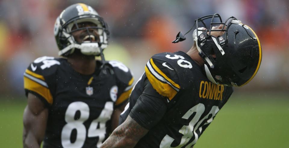 Antonio Brown and James Conner (right) had some moments to celebrate in Sunday’s tie at Cleveland