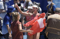 Anouk Verge-Depre, center left, of Switzerland, and teammate Joana Heidrich celebrate winning a women's beach volleyball Bronze match against Latvia at the 2020 Summer Olympics, Friday, Aug. 6, 2021, in Tokyo, Japan. (AP Photo/Petros Giannakouris)