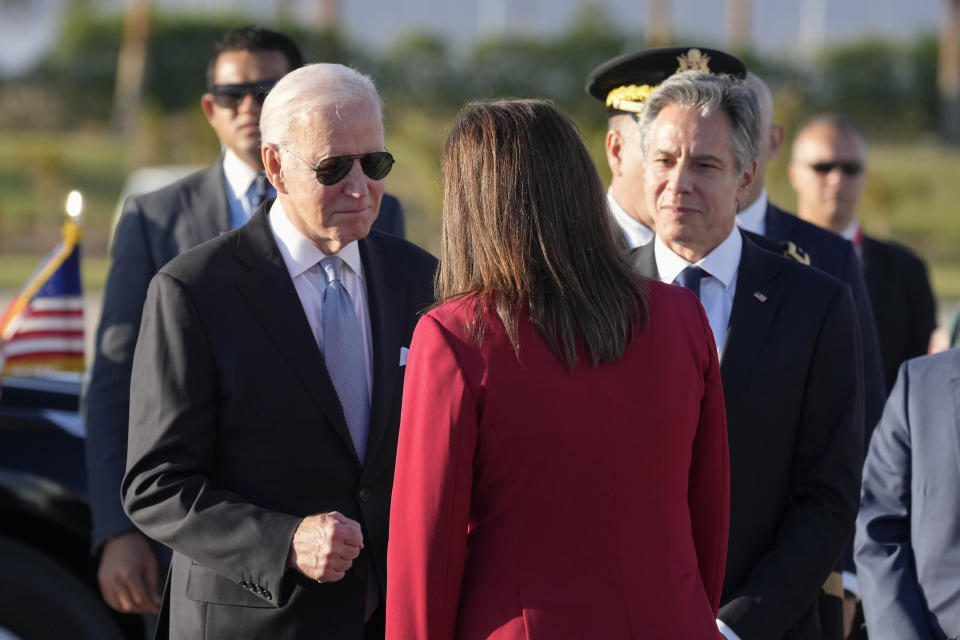 President Joe Biden and Secretary of State Antony Blinken, right, are greeted by Hala Helmy el-Said, Minister of Planning and Economic Development of Egypt, as they arrive Friday, Nov. 11, 2022, at Sharm el-Sheikh, Egypt. (AP Photo/Alex Brandon)