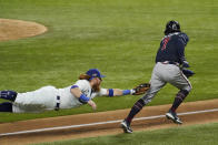 Los Angeles Dodgers third baseman Justin Turner tags Atlanta Braves' Dansby Swanson in a run down during the fourth inning in Game 7 of a baseball National League Championship Series Sunday, Oct. 18, 2020, in Arlington, Texas. (AP Photo/Tony Gutierrez)