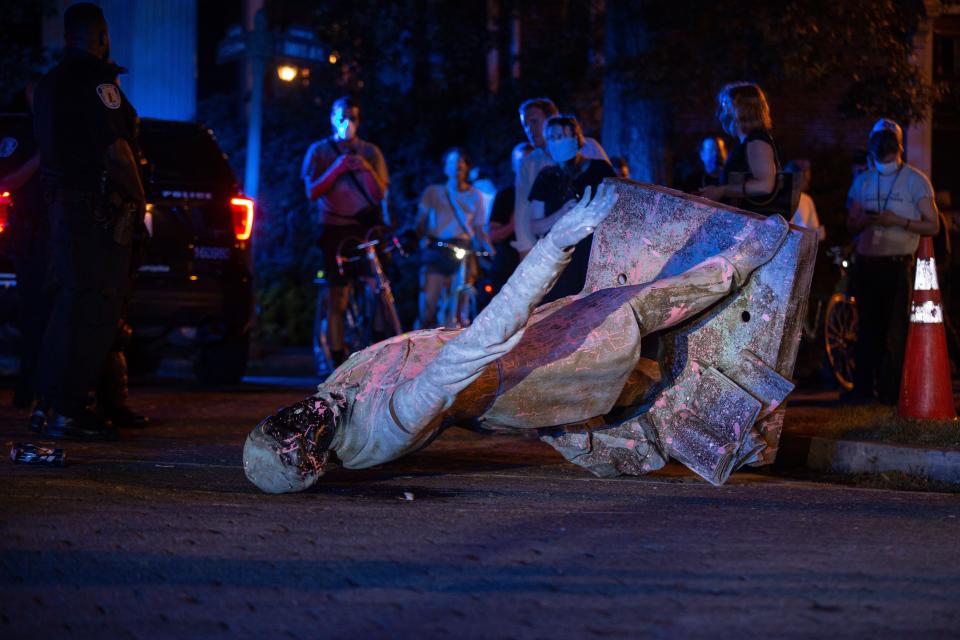 A statue of Confederacy President Jefferson Davis lies on the street after protesters pulled it down in Richmond, Virginia, on June 10. (Photo: PARKER MICHELS-BOYCE via Getty Images)