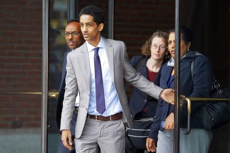 Robel Phillipos (2nd L), a friend of suspected Boston Marathon bomber Dzhokhar Tsarnaev, who is charged with lying to investigators, leaves the federal courthouse after a hearing in his case in Boston, Massachusetts May 13, 2014. REUTERS/Brian Snyder/Files