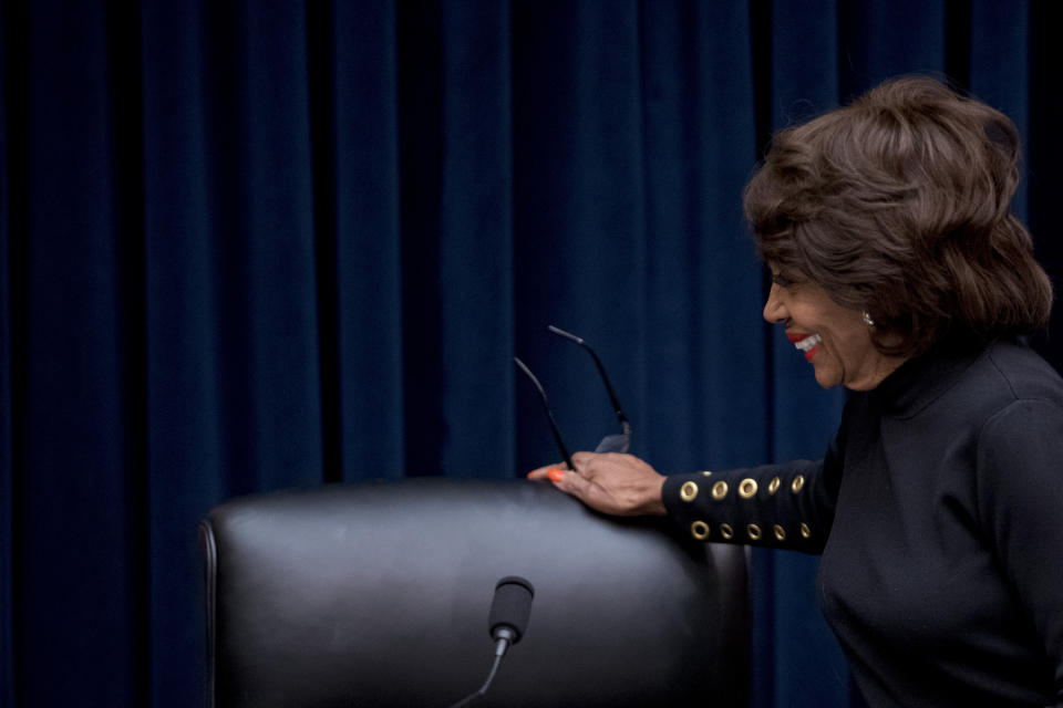 Chairwoman Rep. Maxine Waters, D-Calif., appears before Facebook CEO Mark Zuckerberg arrives for a House Financial Services Committee hearing on Capitol Hill in Washington, Wednesday, Oct. 23, 2019, on Facebook's impact on the financial services and housing sectors. (AP Photo/Andrew Harnik)