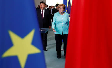 German Chancellor Angela Merkel and Chinese President Xi Jinping attend a contract signing ceremony at the Chancellery in Berlin, Germany, July 5, 2017. REUTERS/Fabrizio Bensch