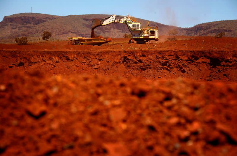 FILE PHOTO: File picture of a giant excavator loading a mining truck at the Fortescue Solomon iron ore mine south of Port Hedland