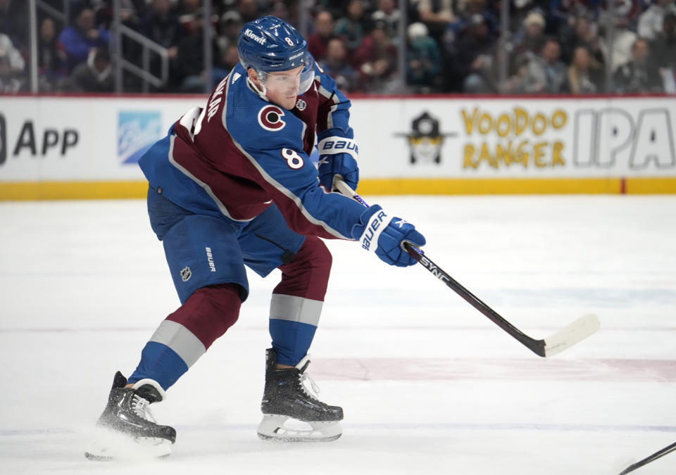 Colorado Avalanche defenseman Cale Makar shoots the puck in the first period of an NHL hockey game against the San Jose Sharks Tuesday, March 7, 2023, in Denver. (AP Photo/David Zalubowski)