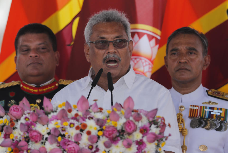Sri Lanka's newly elected president Gotabaya Rajapaksa addresses the nation after his swearing in ceremony held at the 140 B.C Ruwanweli Seya Buddhist temple in ancient kingdom of Anuradhapura in northcentral Sri Lanka Monday, Nov. 18, 2019. The former defense official credited with ending a long civil war was Monday sworn in as Sri Lanka’s seventh president after comfortably winning last Saturday’s presidential election. (AP Photo/Eranga Jayawardena)