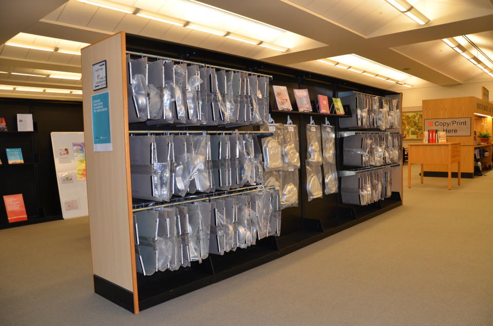 This July 25, 2019 photo shows the cake pan collection at the Akron-Summit County Public Library in Akron, Ohio. The collection was a popular addition to the library and patrons enjoy the chance to use the pans without purchasing them. Many of the options in the collection are cartoon characters suitable for a child's birthday, which also features tiered pans for wedding cakes and other celebrations. (Tim Hite/Akron-Summit County Public Library via AP)