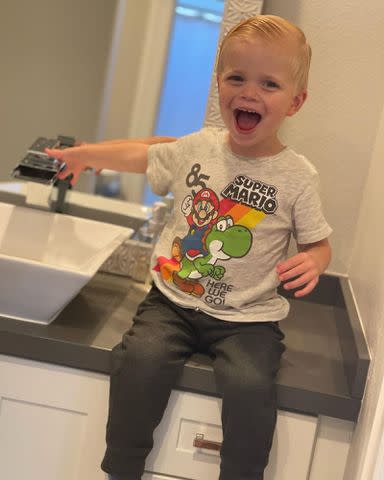 <p>Christina Hall Instagram</p> Christina Hall's son Hudson Anstead poses for a picture