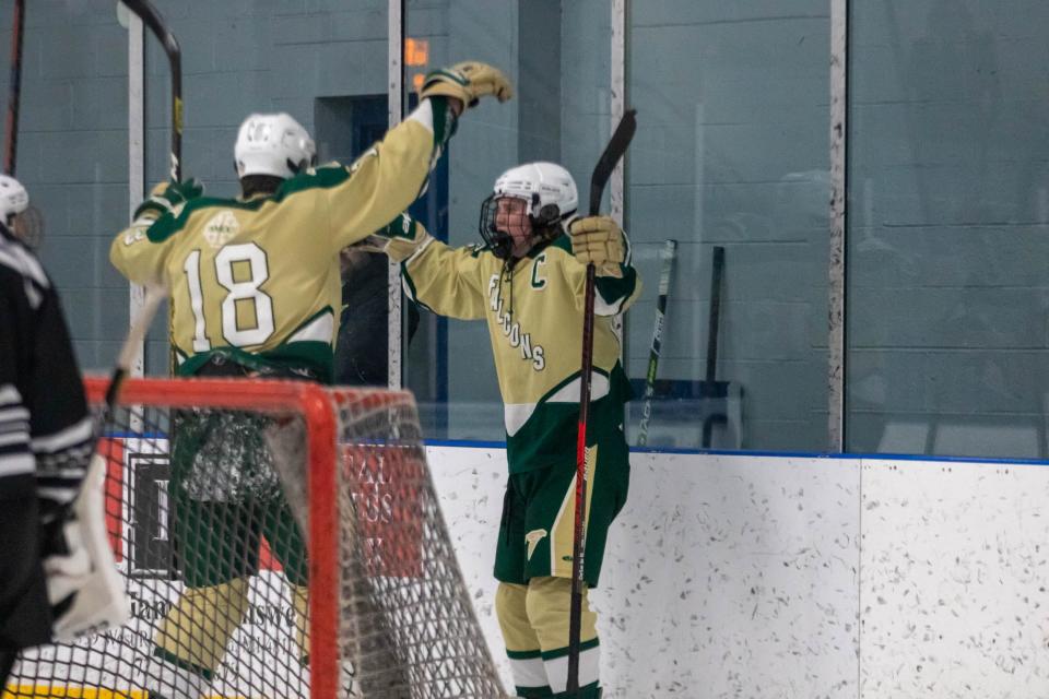 SMCC's Mason Ivey (18) celebrates a goal by captain Riley DeSarbo (right) in the second period against New Boston United Wednesday, Dec. 7, 2022.