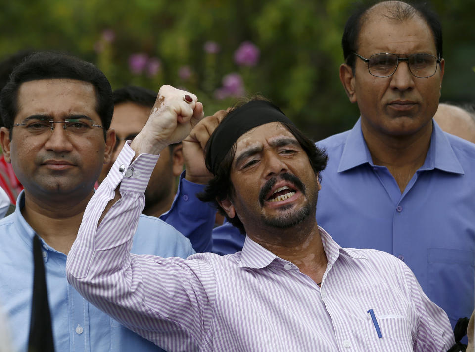 A journalist shouts slogans during a demonstration to denounce rampant censorship in Islamabad, Pakistan, Tuesday, July 16, 2019. Pakistani journalists are holding nationwide protests to denounce rampant censorship by the country's powerful security services, massive layoffs due to budget cuts and months-long delays in payments of their wages. (AP Photo/Anjum Naveed)