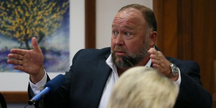 Alex Jones is called up to testify at the Travis County Courthouse during the his defamation trial, in Austin, U.S. August 2, 2022
