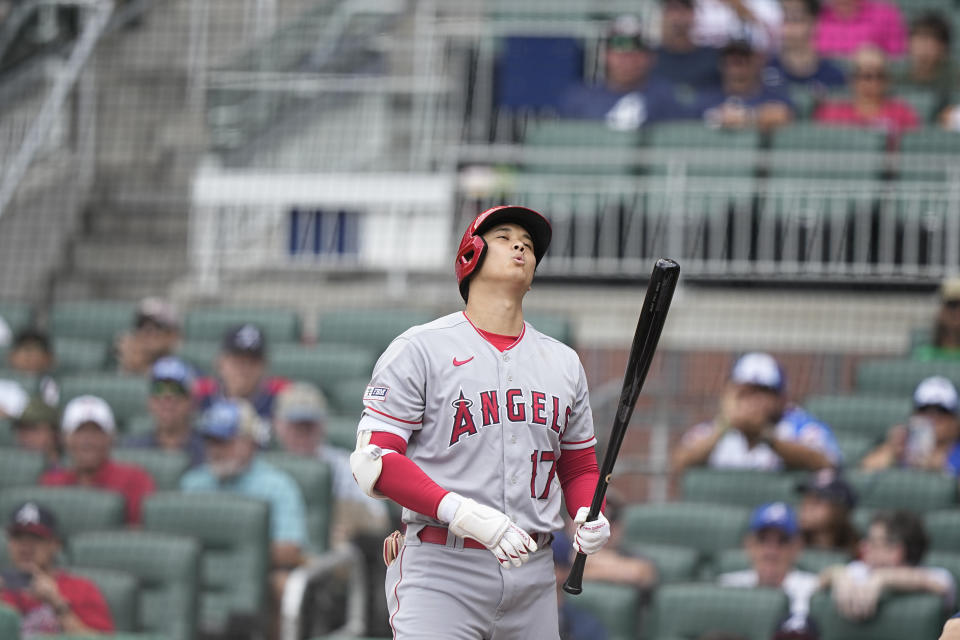 Los Angeles Angels' Shohei Ohtani (17) reacts after a strike in the first inning of a baseball game against the Atlanta Braves, Wednesday, Aug. 2, 2023, in Atlanta. (AP Photo/Brynn Anderson)