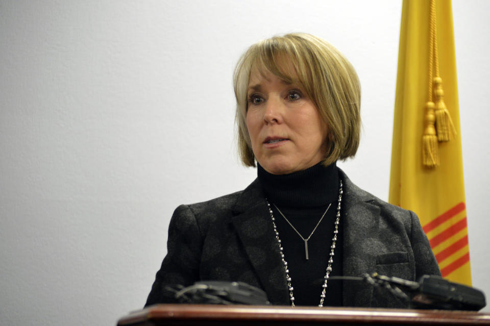 FILE - In this Jan 7, 2019, file photo, New Mexico Gov. Michelle Lujan Grisham speaks at a news conference in Albuquerque, N.M. Lujan Grisham is opposed to plans by a New Jersey-based company to build a multibillion-dollar facility in her state to temporarily store spent nuclear fuel from commercial reactors around the United States. Gov. Grisham sent a letter Friday, June 7, 2019, to U.S. Energy Secretary Rick Perry, saying the interim storage of high-level waste poses significant and unacceptable risks to residents, the environment and the region's economy. (AP Photo/Russell Contreras, File)