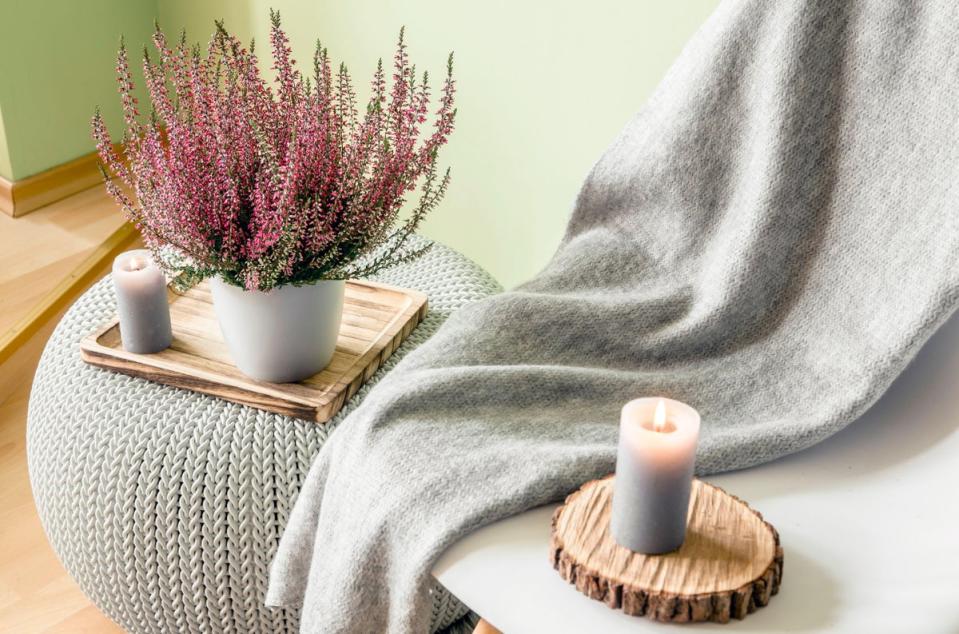 Well-placed candles can make a room feel cosier (Alamy/PA)