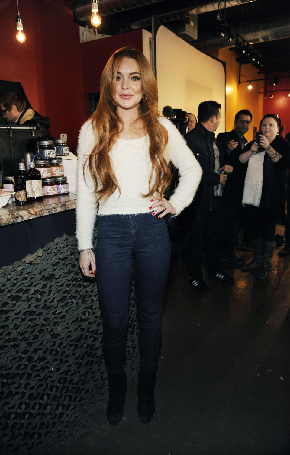Actress Lindsay Lohan poses following a news conference at the 2014 Sundance Film Festival, Monday, Jan. 20, 2014, in Park City, Utah. Producer Randall Emmett and Lohan announced the forthcoming production of a new film, "Inconceivable," in which Lohan will star and co-produce. (Photo by Chris Pizzello/Invision/AP)