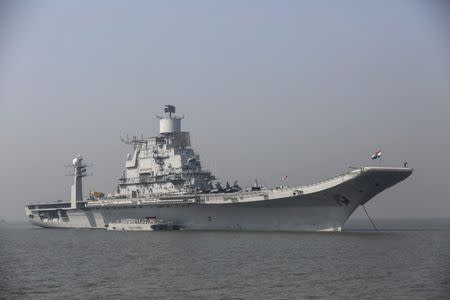 FILE PHOTO: INS Vikramaditya, Indian Navy's aircraft carrier, is seen anchored in the Arabian sea as part of Navy Day celebrations off the coast of Mumbai December 3, 2014. REUTERS/Shailesh Andrade