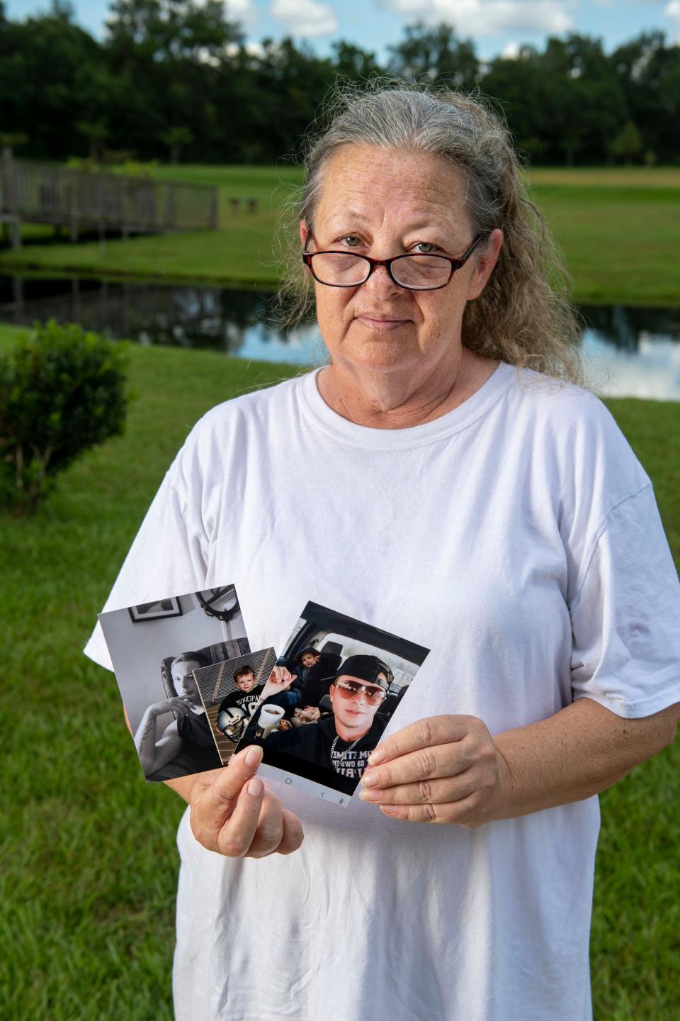 Sarah Burch shows photos of her son, Chadrick Wade, while at Semmes Municipal Park in Semmes, Alabama. Wade died July 4, 2022, in Fountain Correctional Facility.