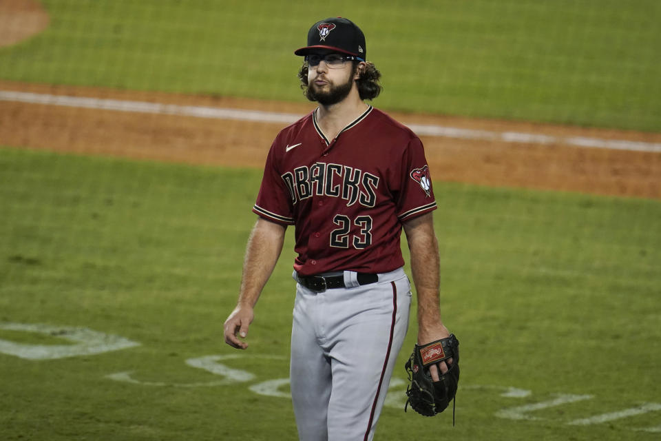 Arizona Diamondbacks starting pitcher Zac Gallen walks off the field after being pulled during the eighth inning of the team's baseball game Los Angeles Dodgers on Wednesday, Sept. 2, 2020, in Los Angeles. (AP Photo/Marcio Jose Sanchez)