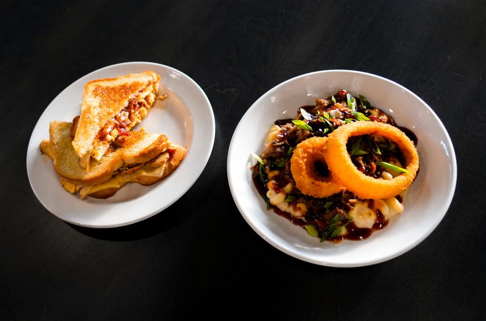 The turkey, bacon and havarti melt, left, and mac & cheese bowl from Four Mile Pig, a barbecue restaurant at The Galley on the Levee in Newport.