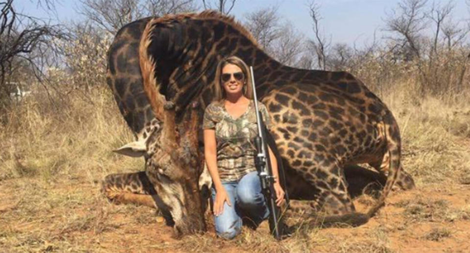 Tess Thompson Talley poses infront of the giraffe she shot and killed.