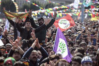 Thousands of supporters of pro-Kurdish Peoples' Democratic Party, or HDP, gather to celebrate the Kurdish New Year and to attend a campaign rally for local elections that will test the Turkish president's popularity, in Istanbul, Sunday, March 24, 2019. The HDP held the event amid the municipal office races that have become polarizing and a government crackdown on its members for alleged links to outlawed Kurdish militants. (AP Photo/Emrah Gurel)