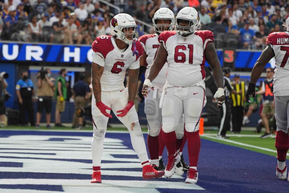 Oct 3, 2021; Inglewood, California, USA; Arizona Cardinals running back James Conner (6) celebrates with center Rodney Hudson (61) after scoring on a 1-yard touchdown run in the third quarter against the Los Angeles Rams at SoFi Stadium. The Cardinals defeated the Rams 37-20.