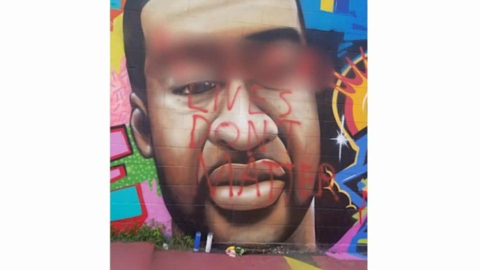 A colorful mural honoring the life of George Floyd in his native Houston by artist Daniel Anguilu was defaced — and not for the first time — but has since been repaired by Anguilu. (KHOU 11)