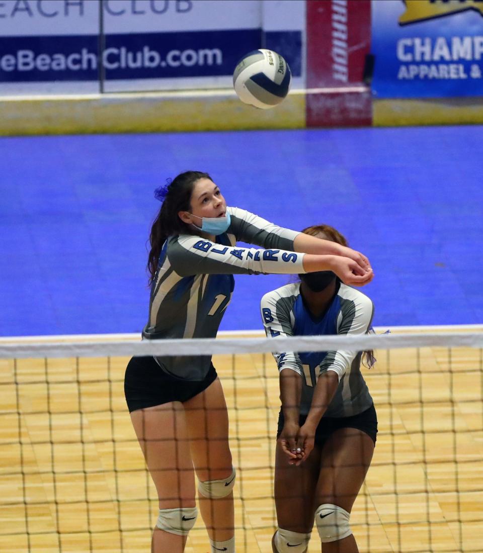 Millbrook's Natalie Fox (16) with a dig during pool play action in the NYSPHSAA girls volleyball championships at Cool Insuring Arena in Glens Falls on Saturday, November 20, 2021.