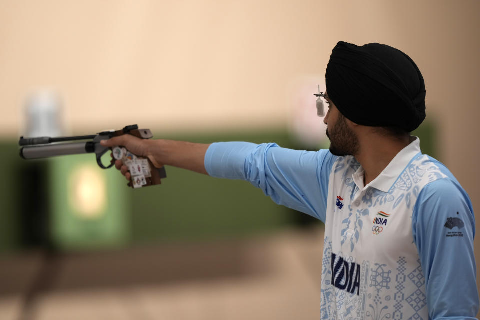 India's Sarabjot Singh shoots during the Shooting 10m Air Pistol Mixed Team gold medal match against China for the 19th Asian Games in Hangzhou, China, Saturday, Sept. 30, 2023. (AP Photo/Ng Han Guan)