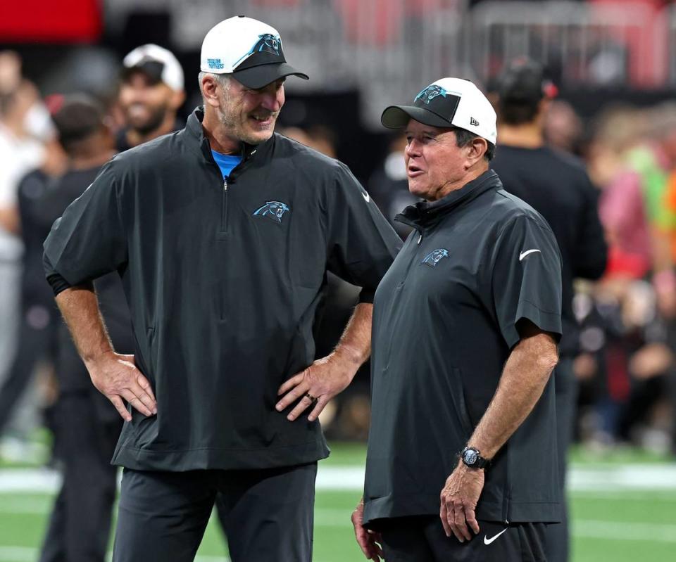 Carolina Panthers head coach Frank Reich, left and senior defensive assistant Dom Capers, right, share a moment together at midfield at Mercedes-Benz Stadium in Atlanta, GA on Sunday, September 10, 2023. The Panthers open the NFL season against the Atlanta Falcons.