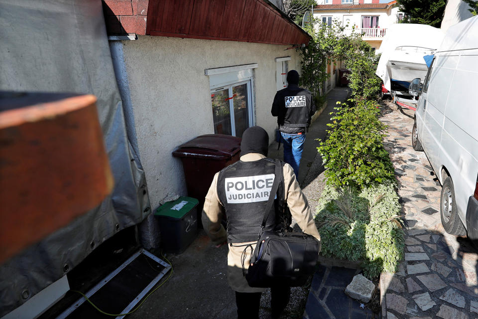 French police arrive at the house of the gunman in Paris