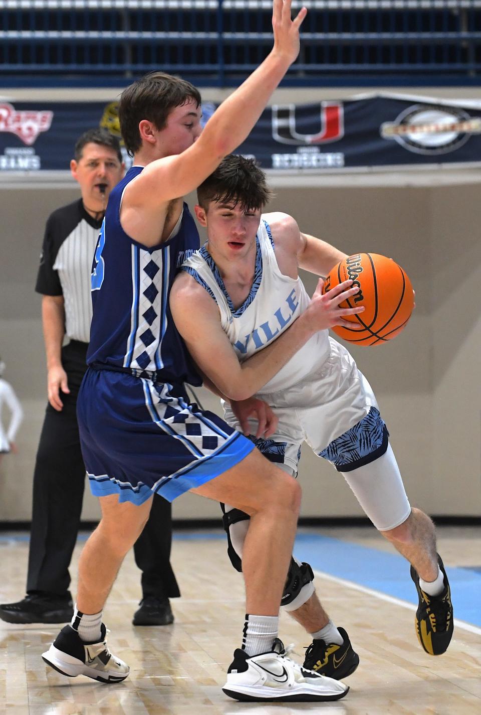 Bartlesville High School's Eli Robertston (1) drives the ball against an Oklahoma City Storm player during basketball action in Bartlesville on Jan. 11, 2024.