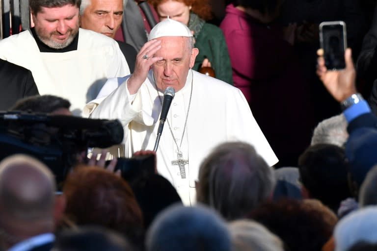 Pope Francis blesses the crowd as he leaves the Basilica of St. Bartholomew on Tiber Island after the Liturgy of the Word with the Community of Sant’Egidio in memory of the "New Martyrs" of the 20th and 21th century, on April 22, 2017 in Rome