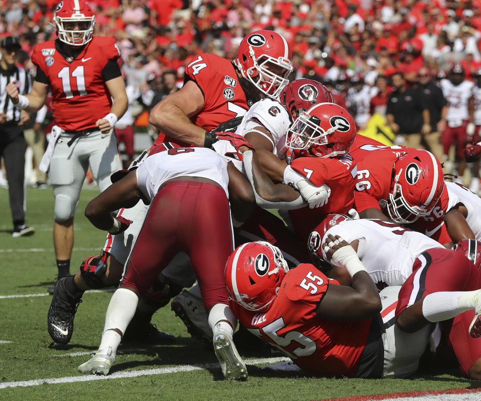 Georgia tailback (7) D'Andre Swift powers his way into the endzone for a one-yard touchdown run against South Carolina during the second quarter of an NCAA college football game, Saturday, Oct., 12, 2019, in Athens, Ga. (Curtis Compton/Atlanta Journal-Constitution via AP)