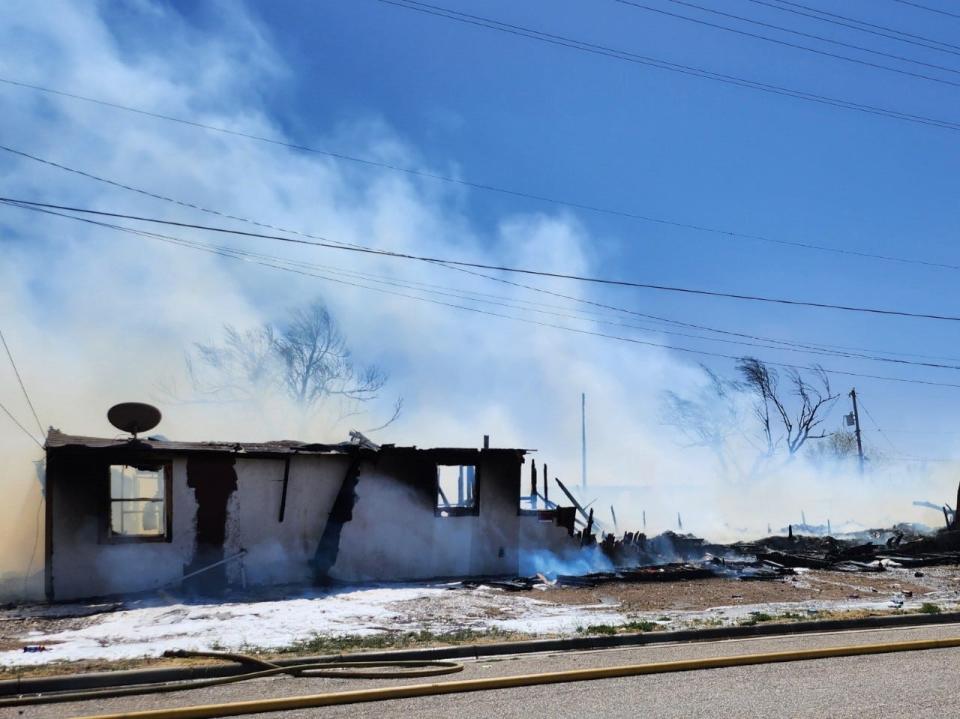 Amarillo firefighters battle a fire involving two structures near NW 3rd and N Jefferson near downtown Amarillo on Friday afternoon.