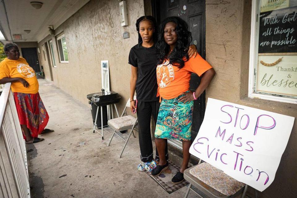 Sedrika Jacques, right, and her daughter, Rondria Brown, 21, pose outside of their apartment that they share with a few others at the Lincoln Fields Apartments on Tuesday, May 23, 2023, down the street from Liberty Square in Miami. The two say they got a court case thrown out because management said they owed them money, but they had proof and kept the receipts that they paid their bills. “I know being the one standing up for my community I’m going to be retaliated against. They’re gonna come after me, try to evict me,” said Jacques.